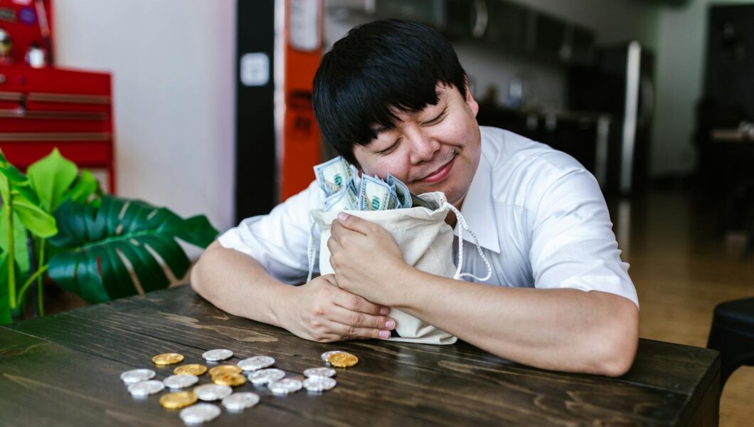 A happy trader hugging a bag of cash and cryptocurrency coins, symbolizing investment success.