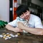 A happy trader hugging a bag of cash and cryptocurrency coins, symbolizing investment success.