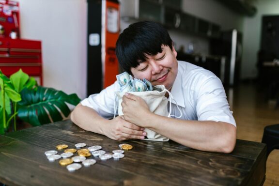 A happy trader hugging a bag of cash and cryptocurrency coins, symbolizing investment success.